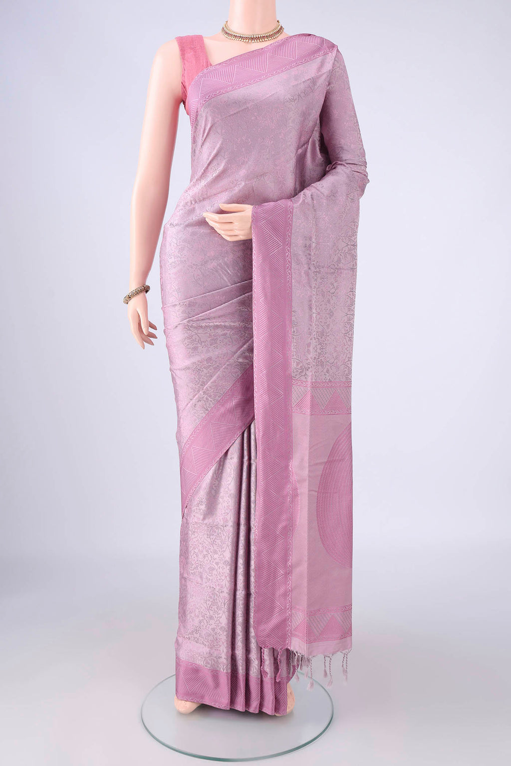 Lavender Soft Silk Saree with Jacquard design on the body and Thread Border.  displayed on a mannequin