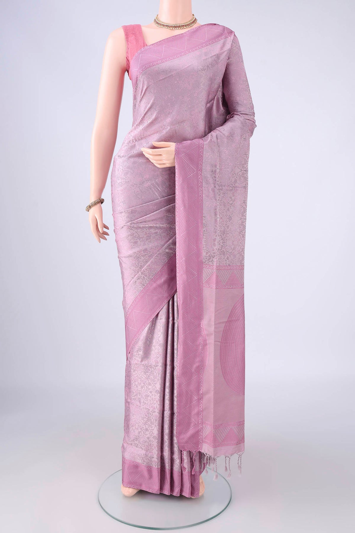 Lavender Soft Silk Saree with Jacquard design on the body and Thread Border.  displayed on a mannequin