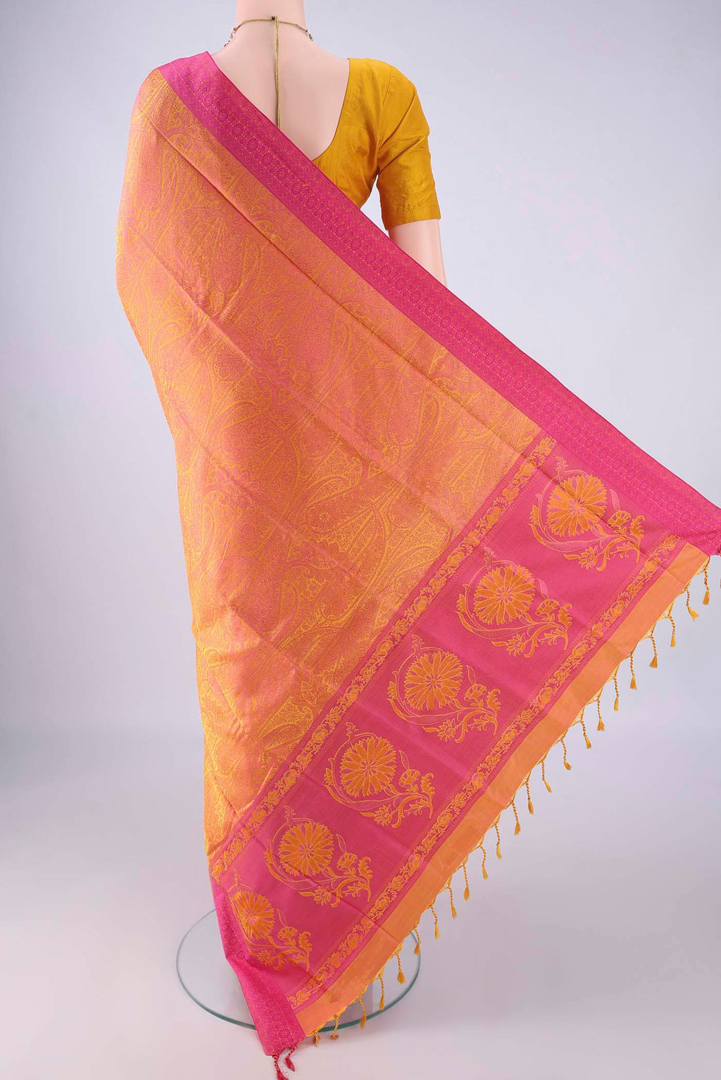 Flat view of Pinkish Yellow Soft Silk Saree with Jacquard design on the body and Thread Border. 