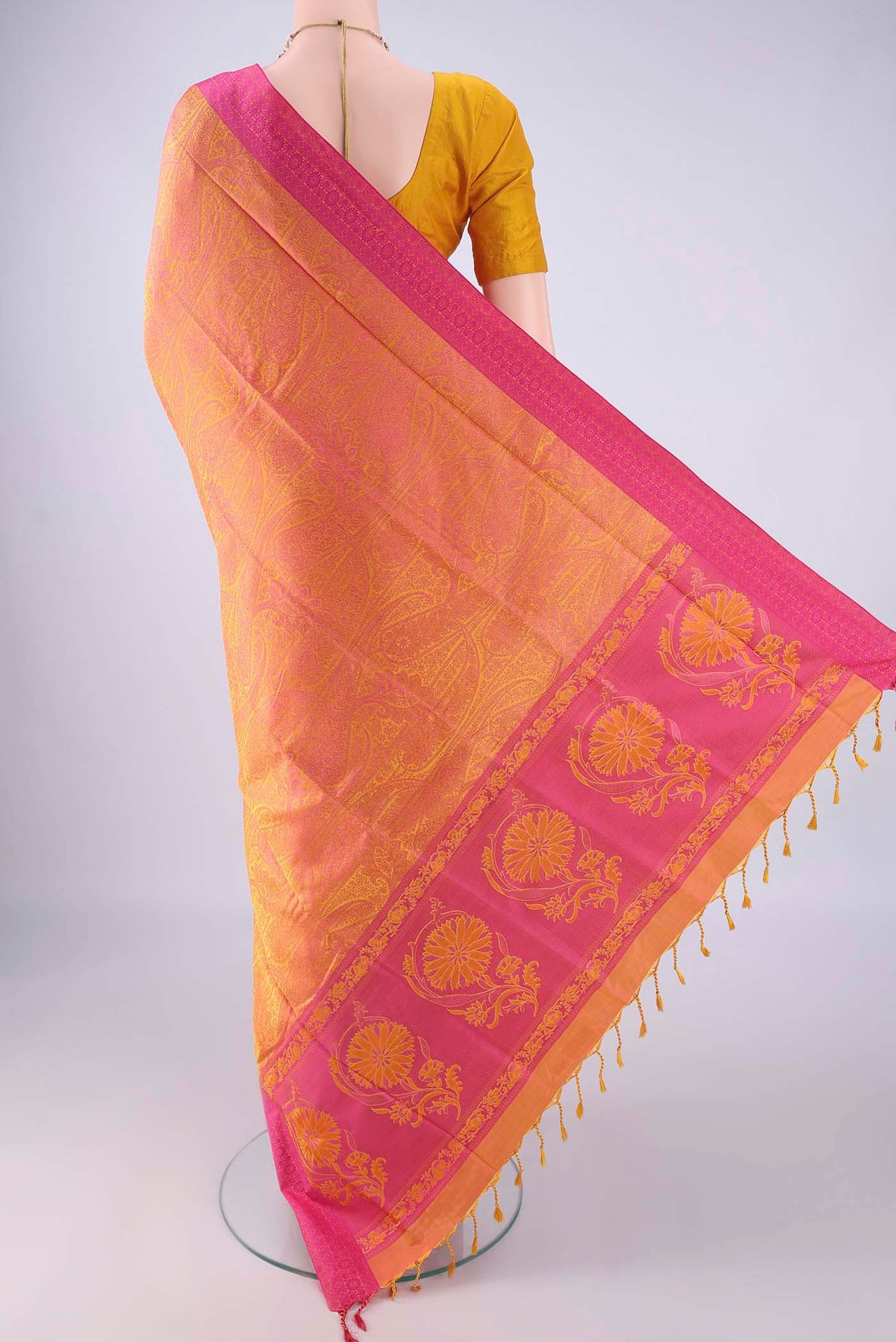 Flat view of Pinkish Yellow Soft Silk Saree with Jacquard design on the body and Thread Border. 