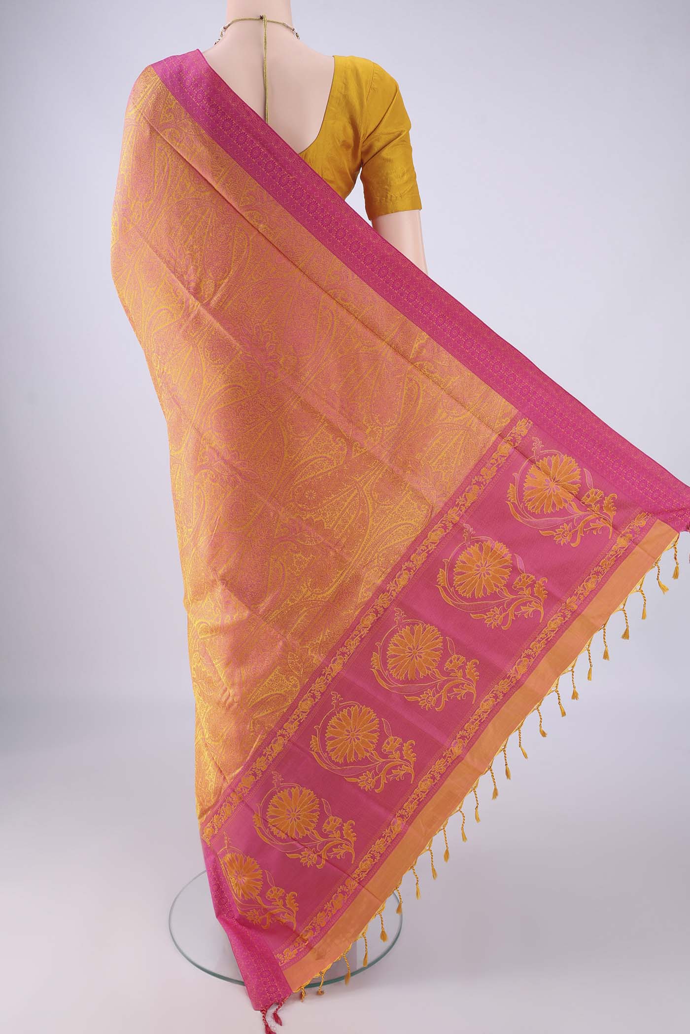 Flat view of Pinkish Yellow Soft Silk Saree with Jacquard design on the body and Thread Border. 