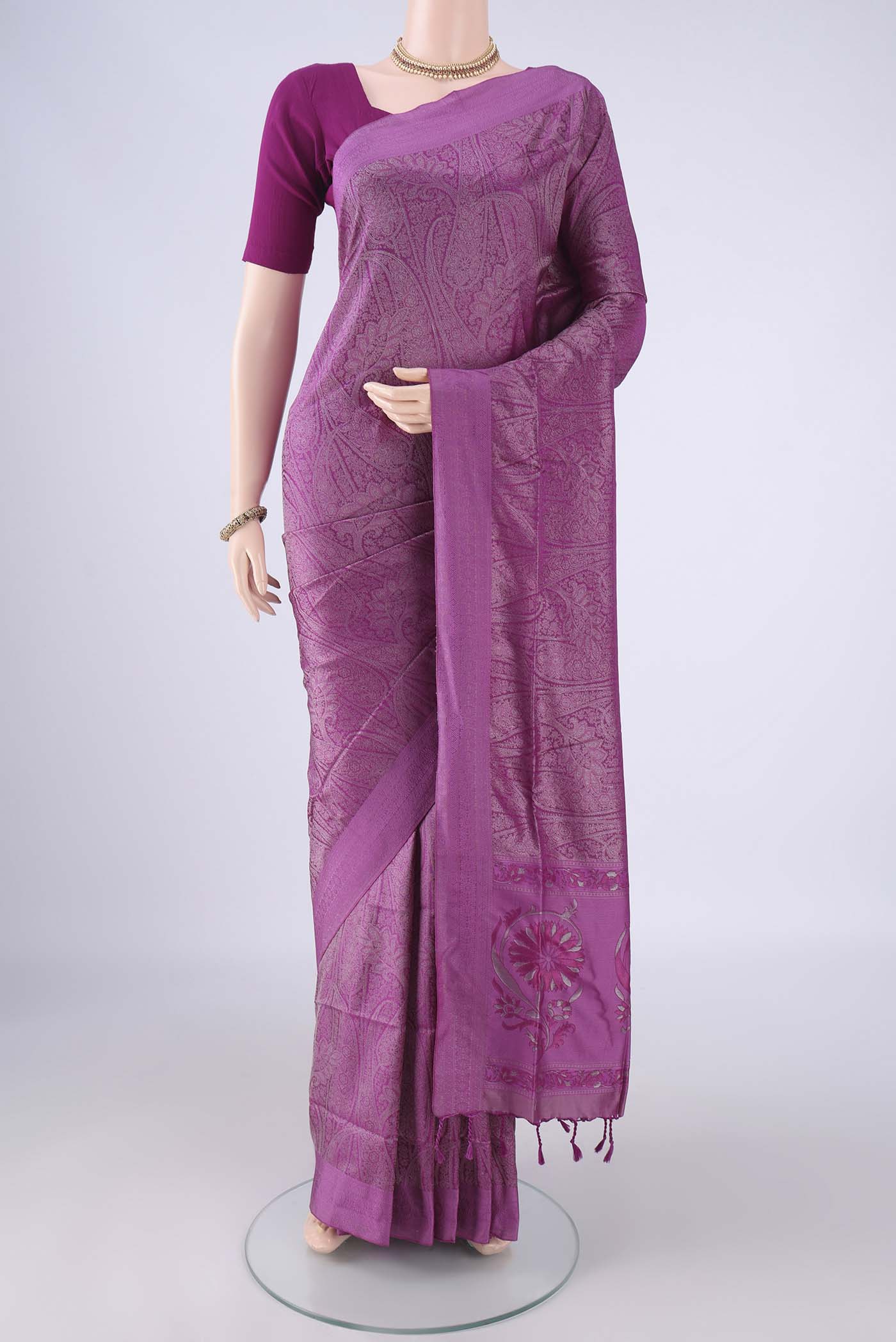 Purple Soft Silk Saree with Jacquard design on the body and Thread Border.  displayed on a mannequin