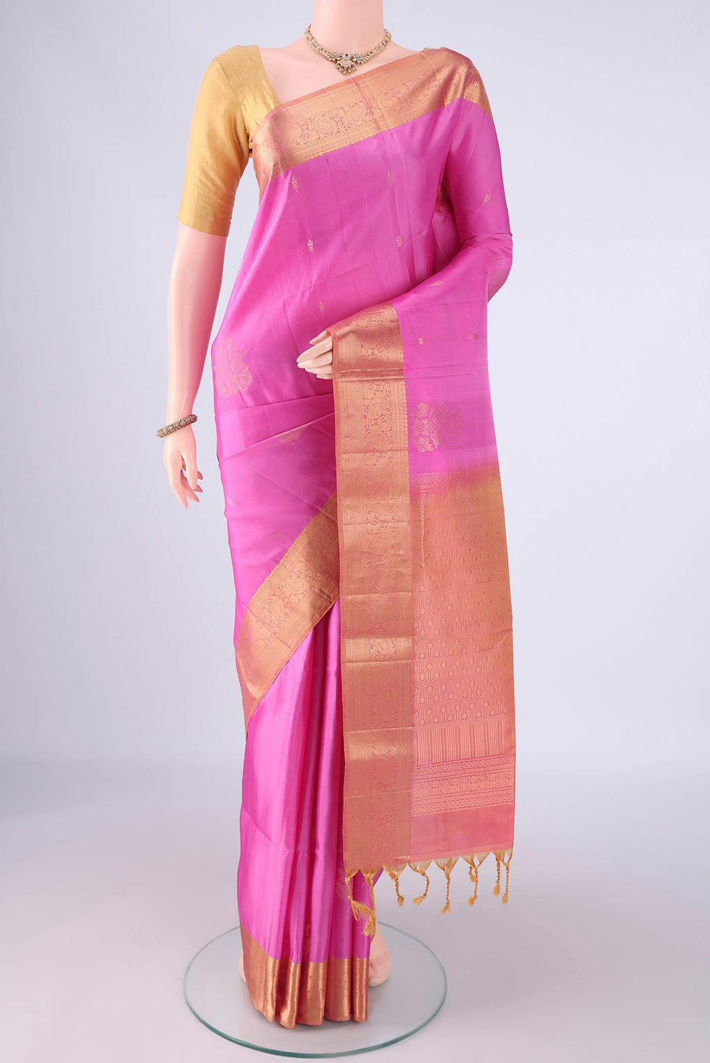 Rose pink Soft Silk Saree with Zari Butta on the body and Zari Border.  displayed on a mannequin