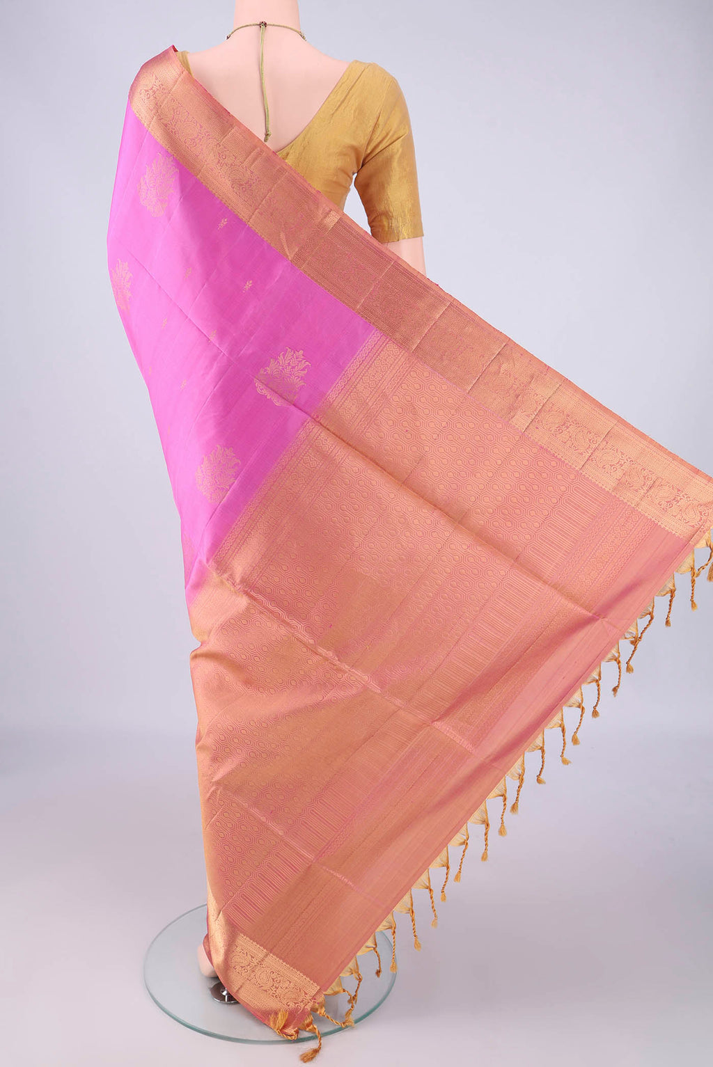 Flat view of Rose pink Soft Silk Saree with Zari Butta on the body and Zari Border. 