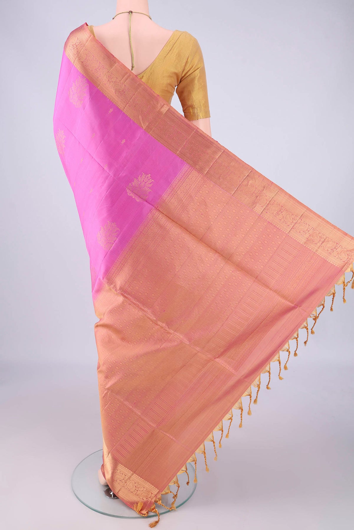 Flat view of Rose pink Soft Silk Saree with Zari Butta on the body and Zari Border. 