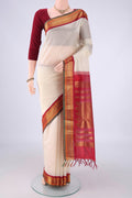 Off White Coimbatore Silk Cotton Saree with Plain Body and Zari Border.  displayed on a mannequin