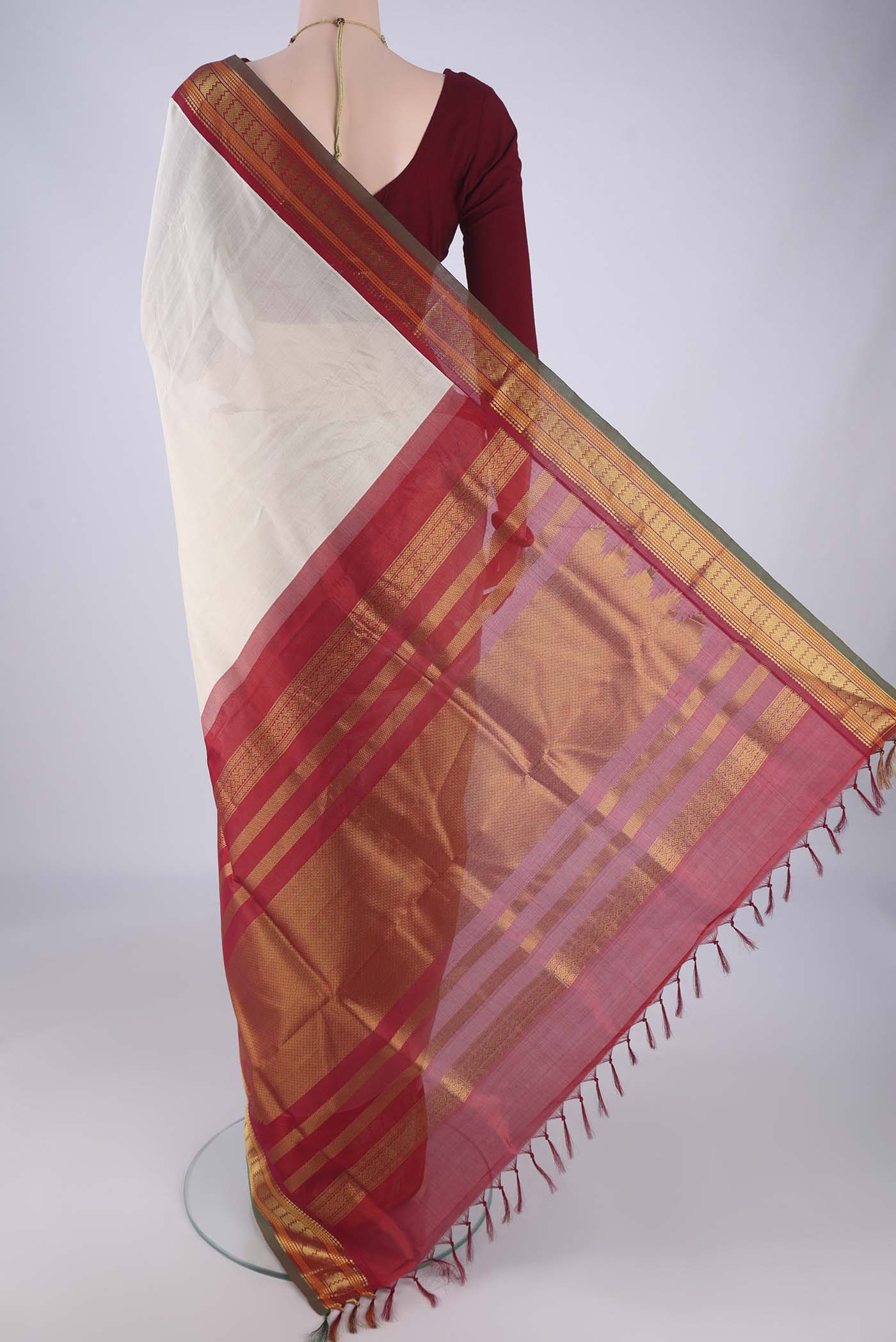 Flat view of Off White Coimbatore Silk Cotton Saree with Plain Body and Zari Border. 