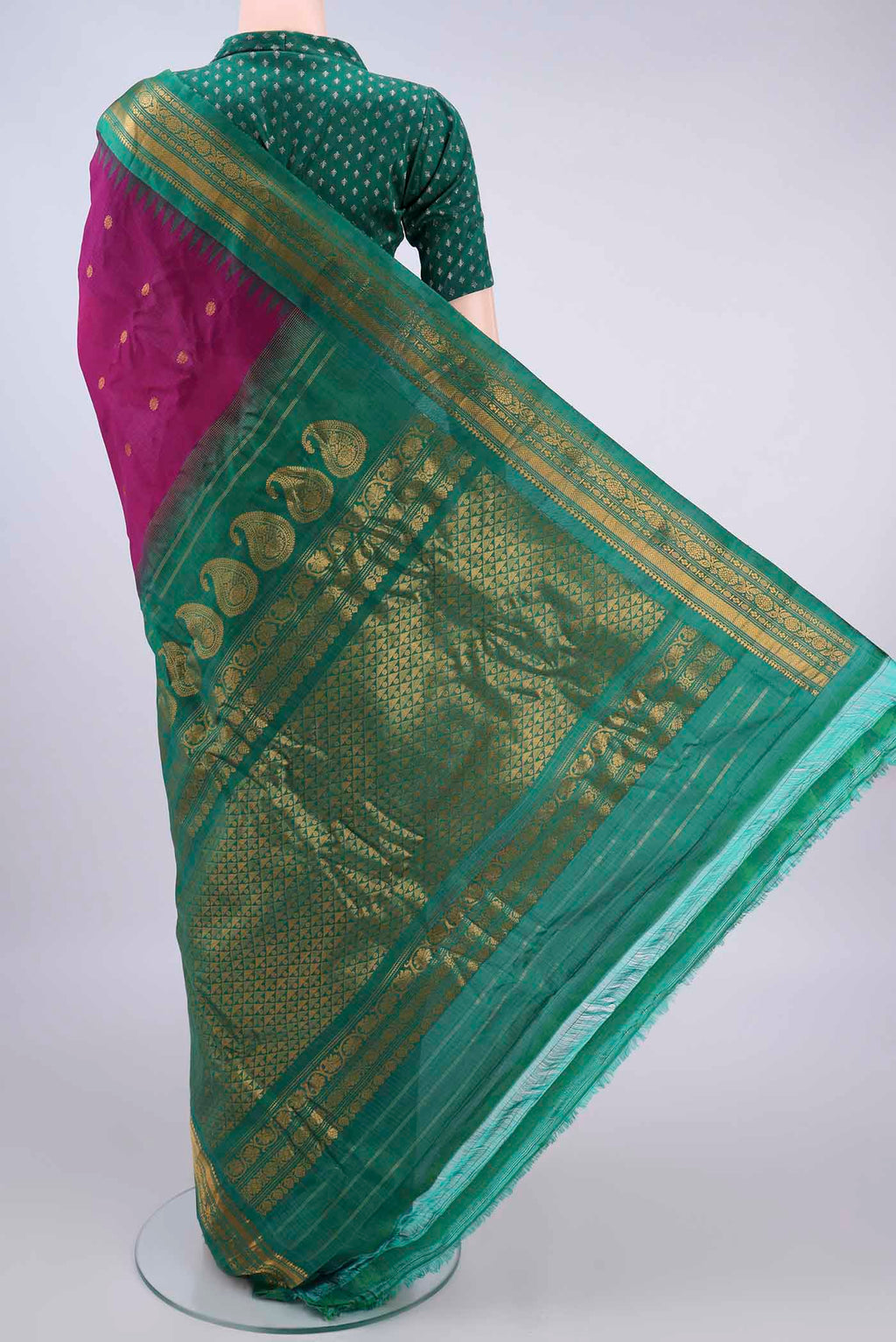 Flat view of Magenta Gadwal Cotton Saree with Zari Butta on the body and Zari Border. 