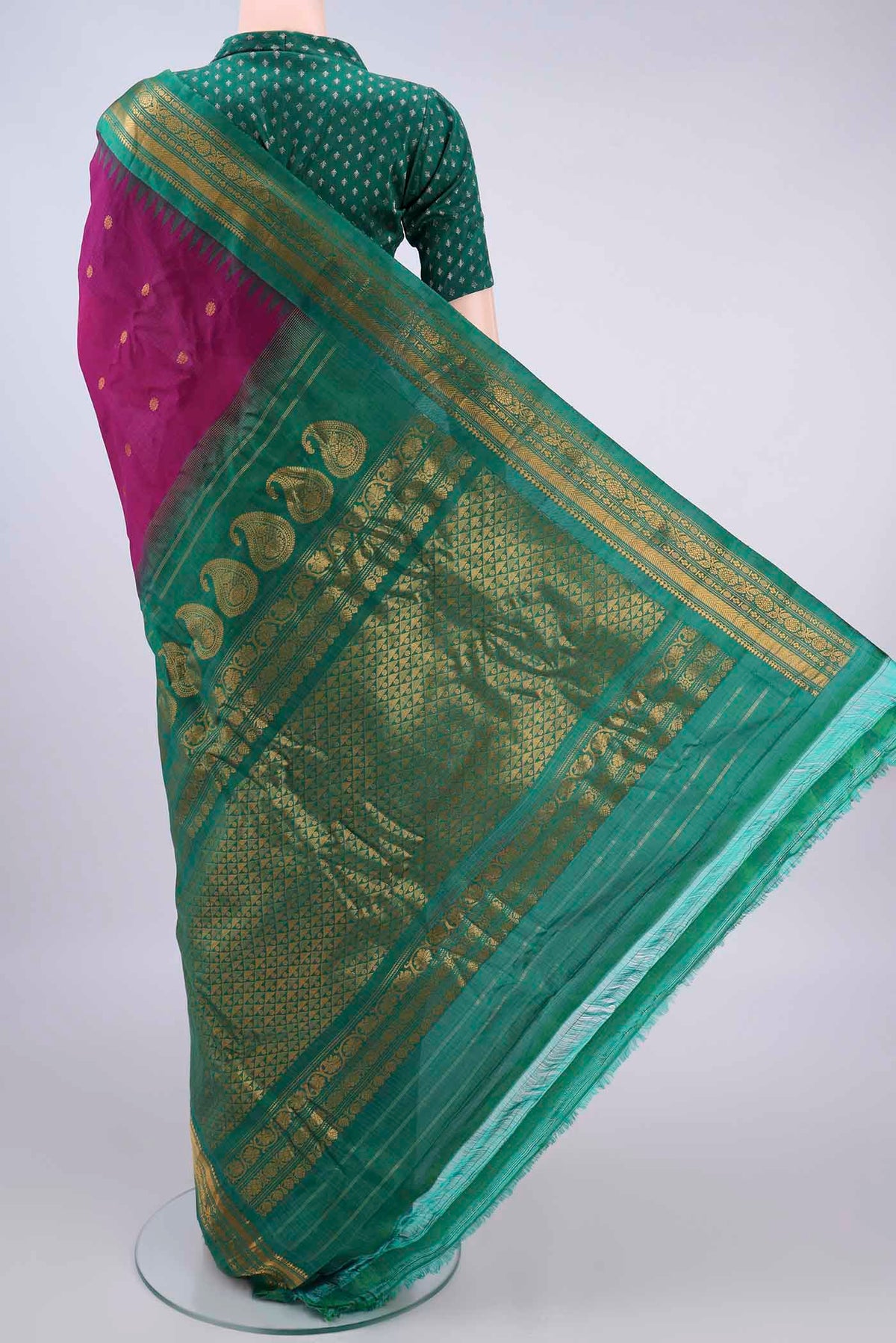Flat view of Magenta Gadwal Cotton Saree with Zari Butta on the body and Zari Border. 
