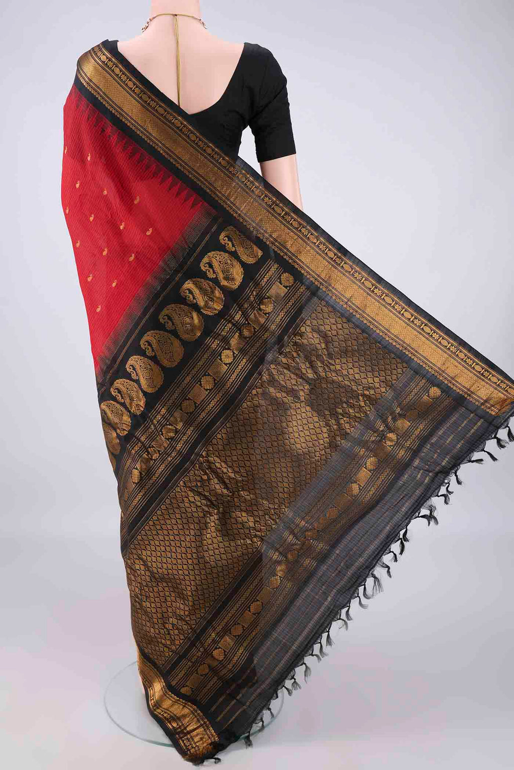 Flat view of Red Gadwal Cotton Saree with Checked design on the body and Zari Border. 
