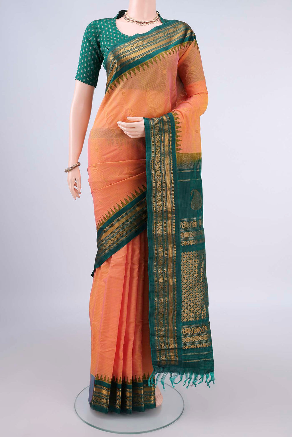Peach Gadwal Cotton Saree with Zari Butta on the body and Zari Border.  displayed on a mannequin