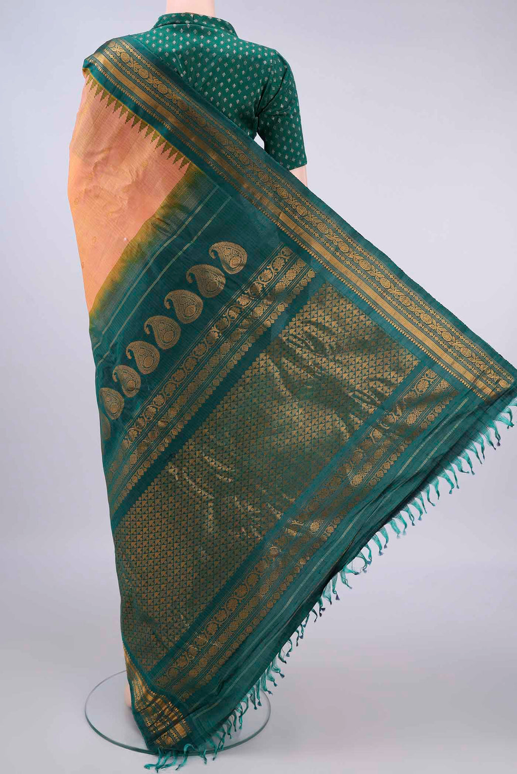 Flat view of Peach Gadwal Cotton Saree with Zari Butta on the body and Zari Border. 