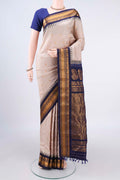 Pure Silk Beige Gadwal Saree with Zari Butta on the body and Zari Border.  displayed on a mannequin