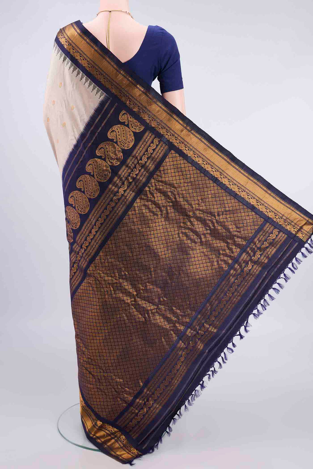 Flat view of Pure Silk Beige Gadwal Saree with Zari Butta on the body and Zari Border. 