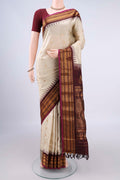 Pure Silk Cream Gadwal Saree with Zari Butta on the body and Zari Border.  displayed on a mannequin