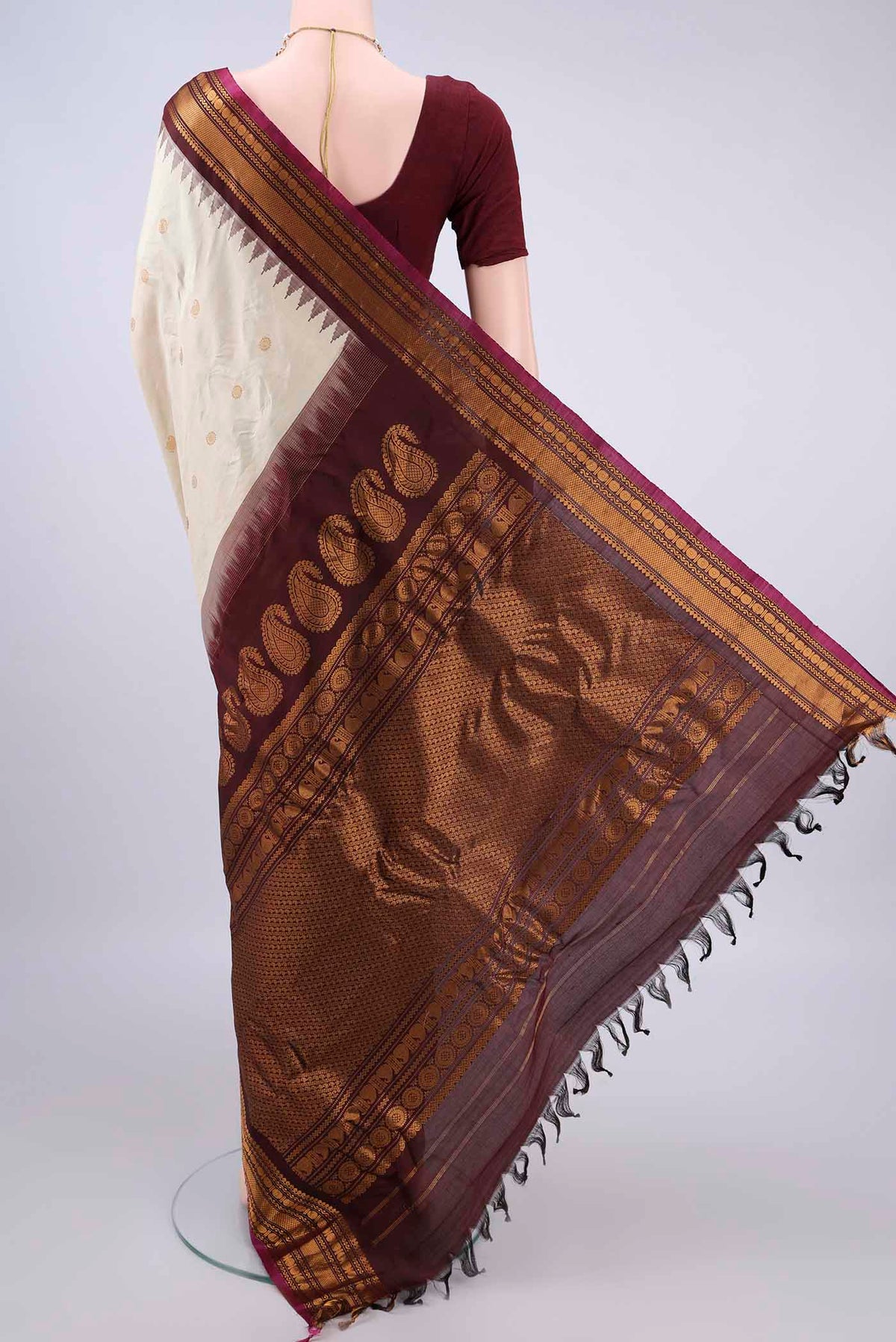 Flat view of Pure Silk Cream Gadwal Saree with Zari Butta on the body and Zari Border. 