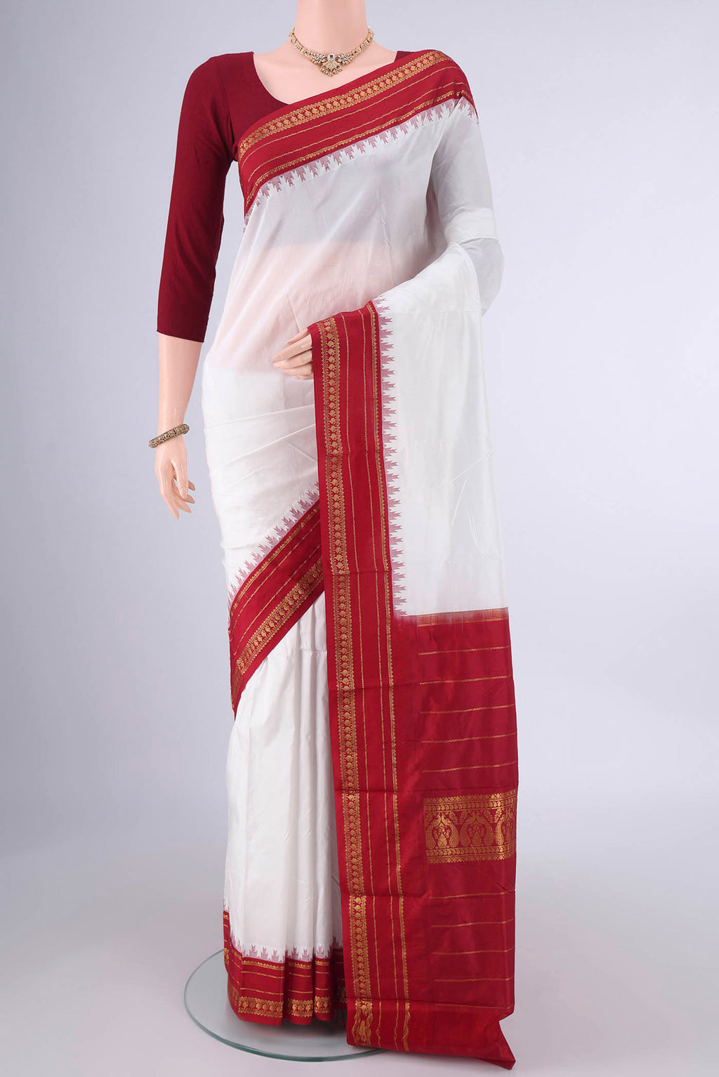 Pure Silk White Bangalore - kadyal Saree with Plain Body and Temple Border.  displayed on a mannequin