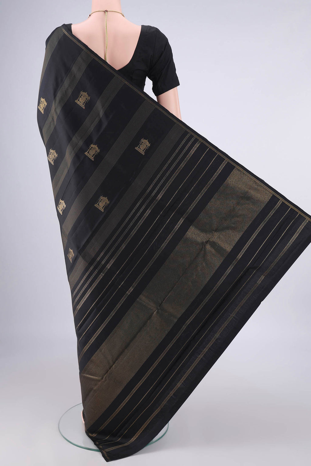 Flat view of Pure Silk Pure Zari Black Kanjivaram Saree with Stripes on the body and Zari Border. 