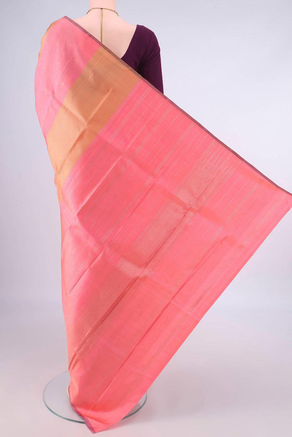 Flat view of Pure Silk Coral Kanjivaram Saree with Stripes on the body and Without Border. 
