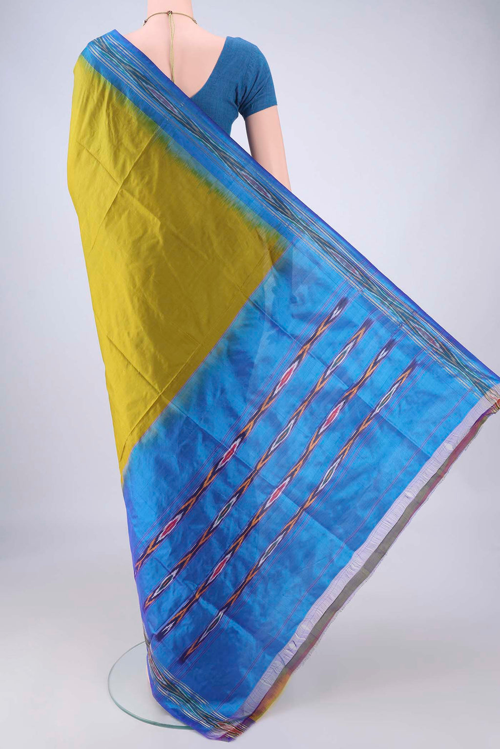 Flat view of Mehandi Green Pochampally Silk Saree with Plain Body and Ikat Border. 