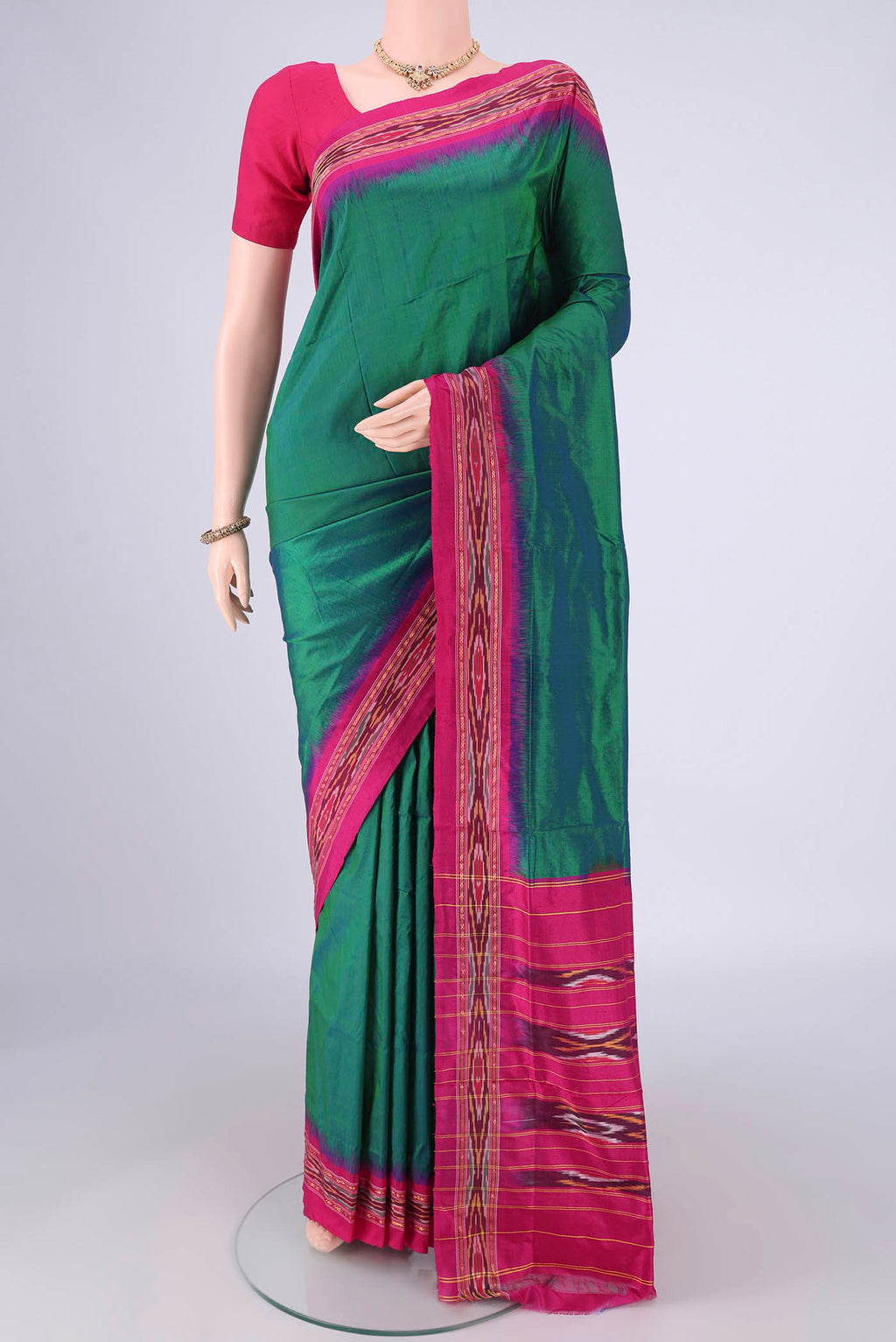 Peacock Blue Pochampally Silk Saree with Plain Body and Zari Border.  displayed on a mannequin