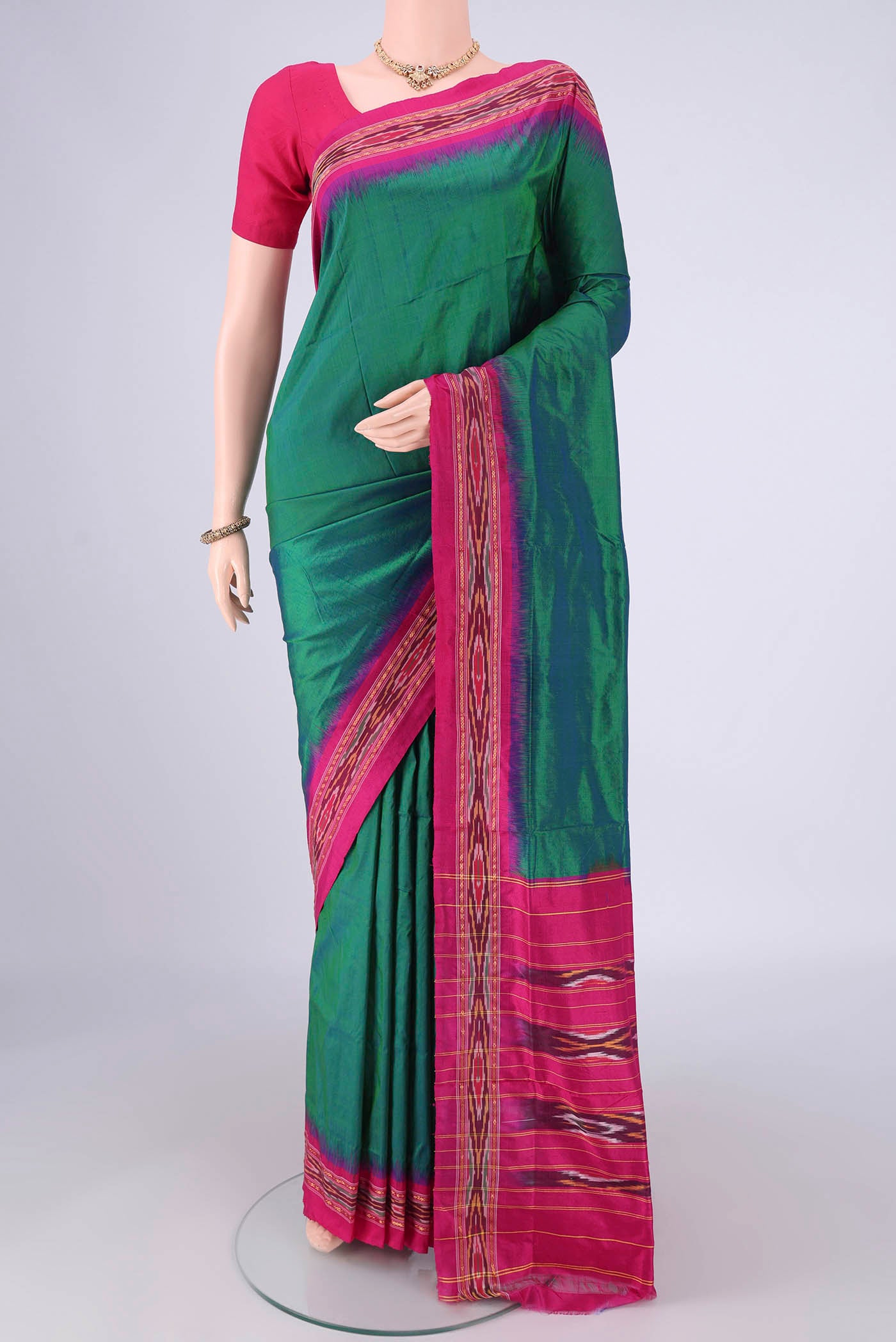 Peacock Blue Pochampally Silk Saree with Plain Body and Zari Border.  displayed on a mannequin