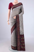 Davys Grey Pochampally Silk Saree with Ikat design on the body and Ikat Border.  displayed on a mannequin