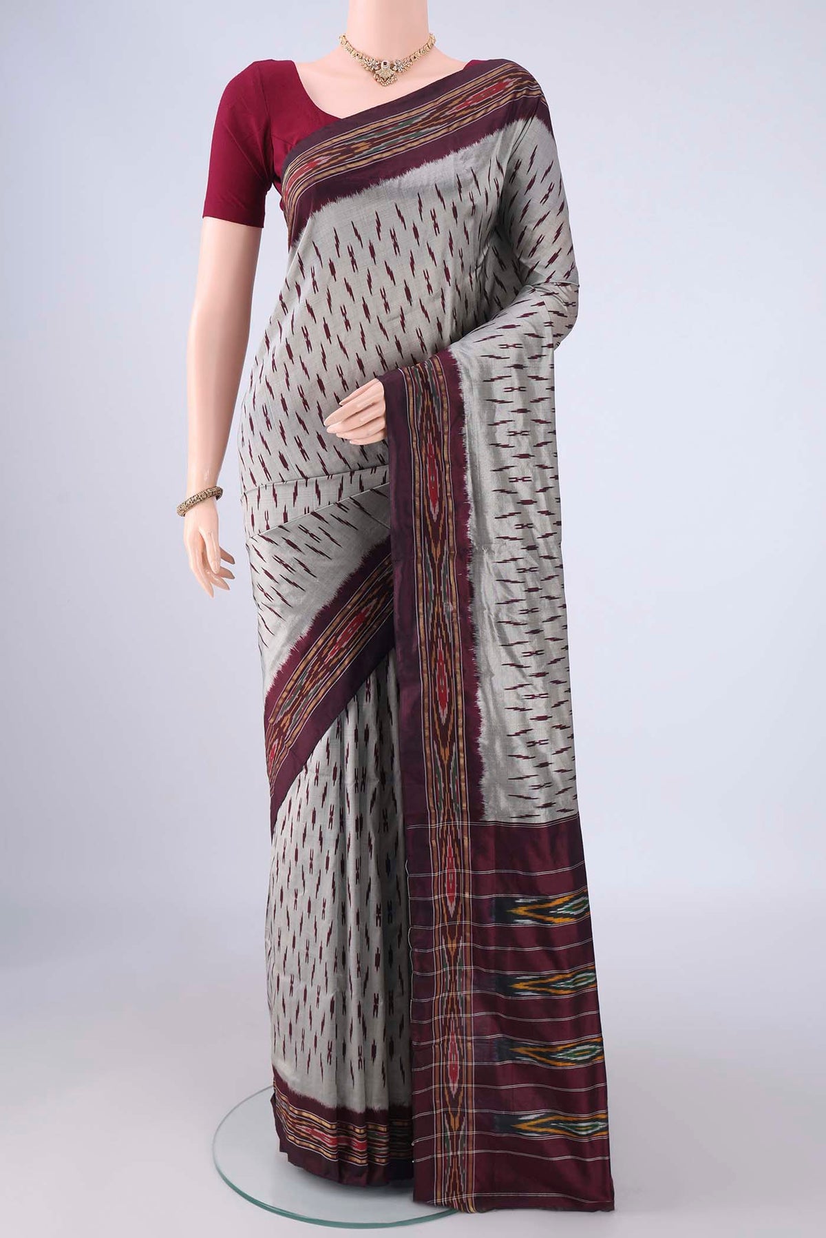 Davys Grey Pochampally Silk Saree with Ikat design on the body and Ikat Border.  displayed on a mannequin