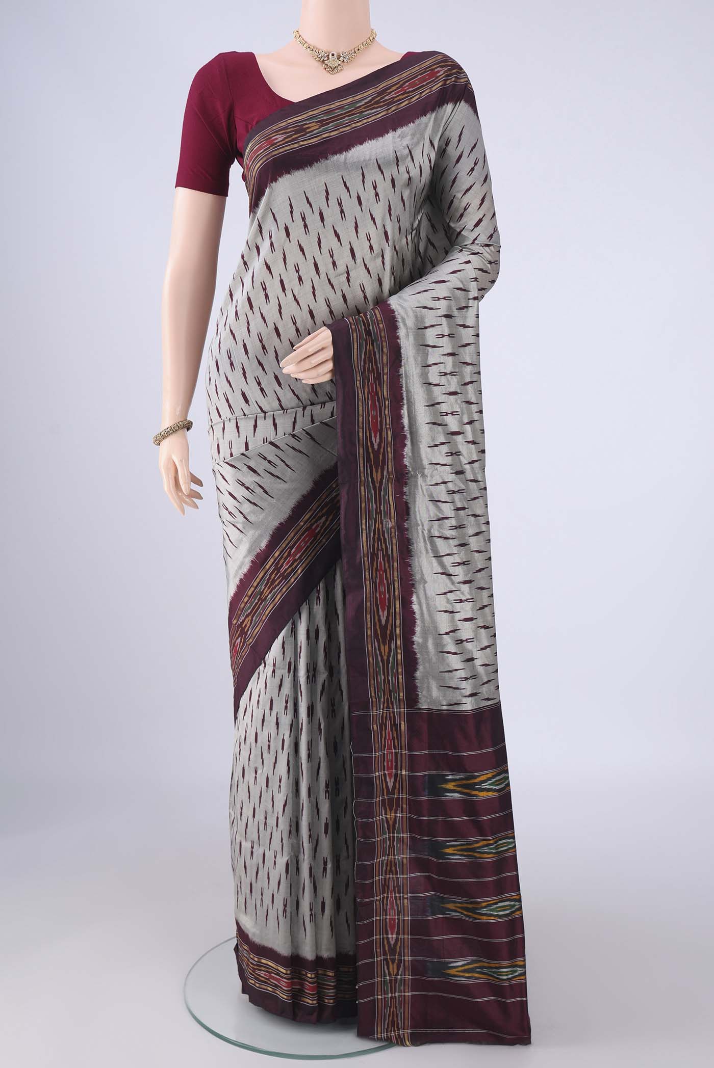 Davys Grey Pochampally Silk Saree with Ikat design on the body and Ikat Border.  displayed on a mannequin