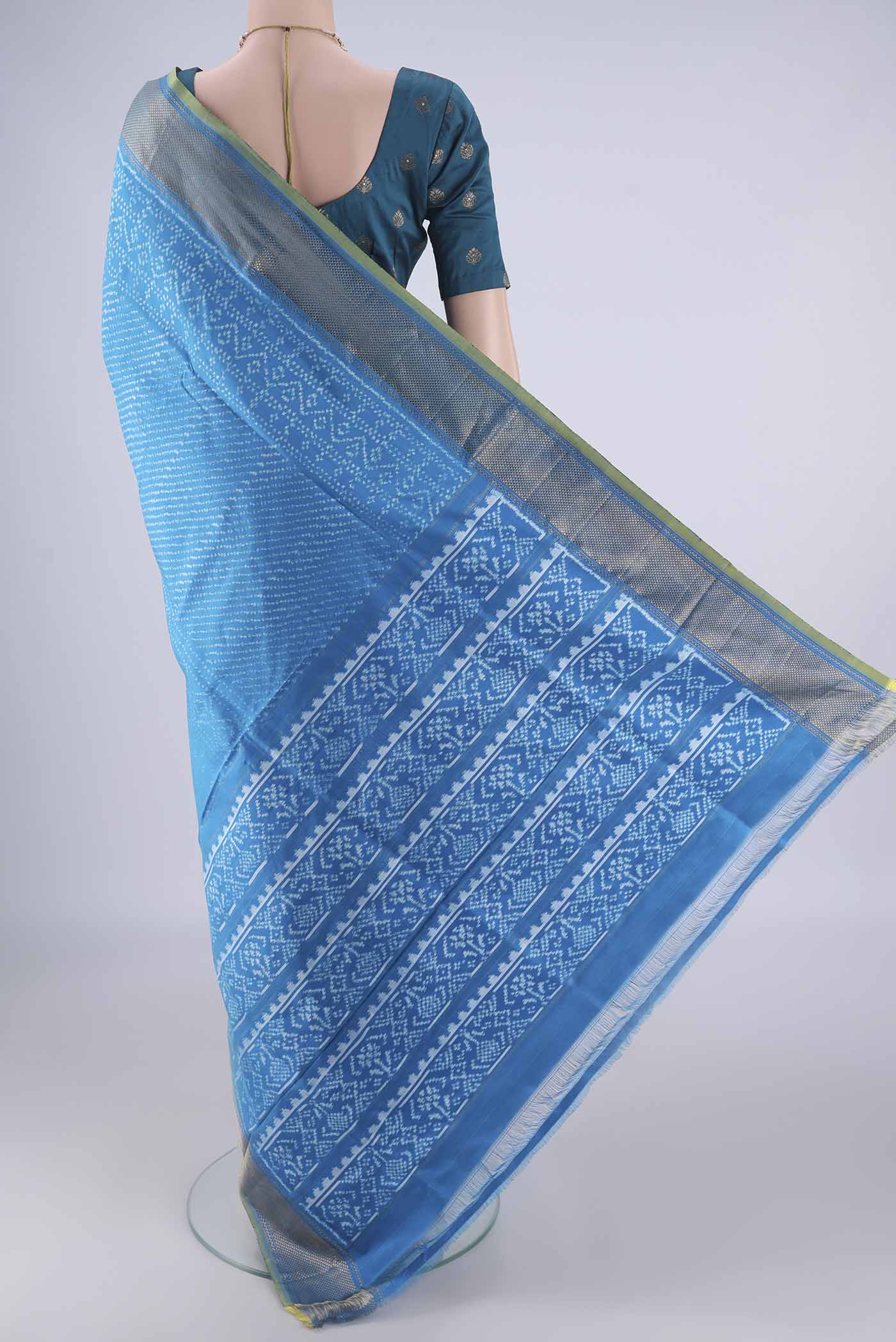 Flat view of Electric Blue Pochampally Silk Saree with Pure Ikat on the body and Zari Border. 