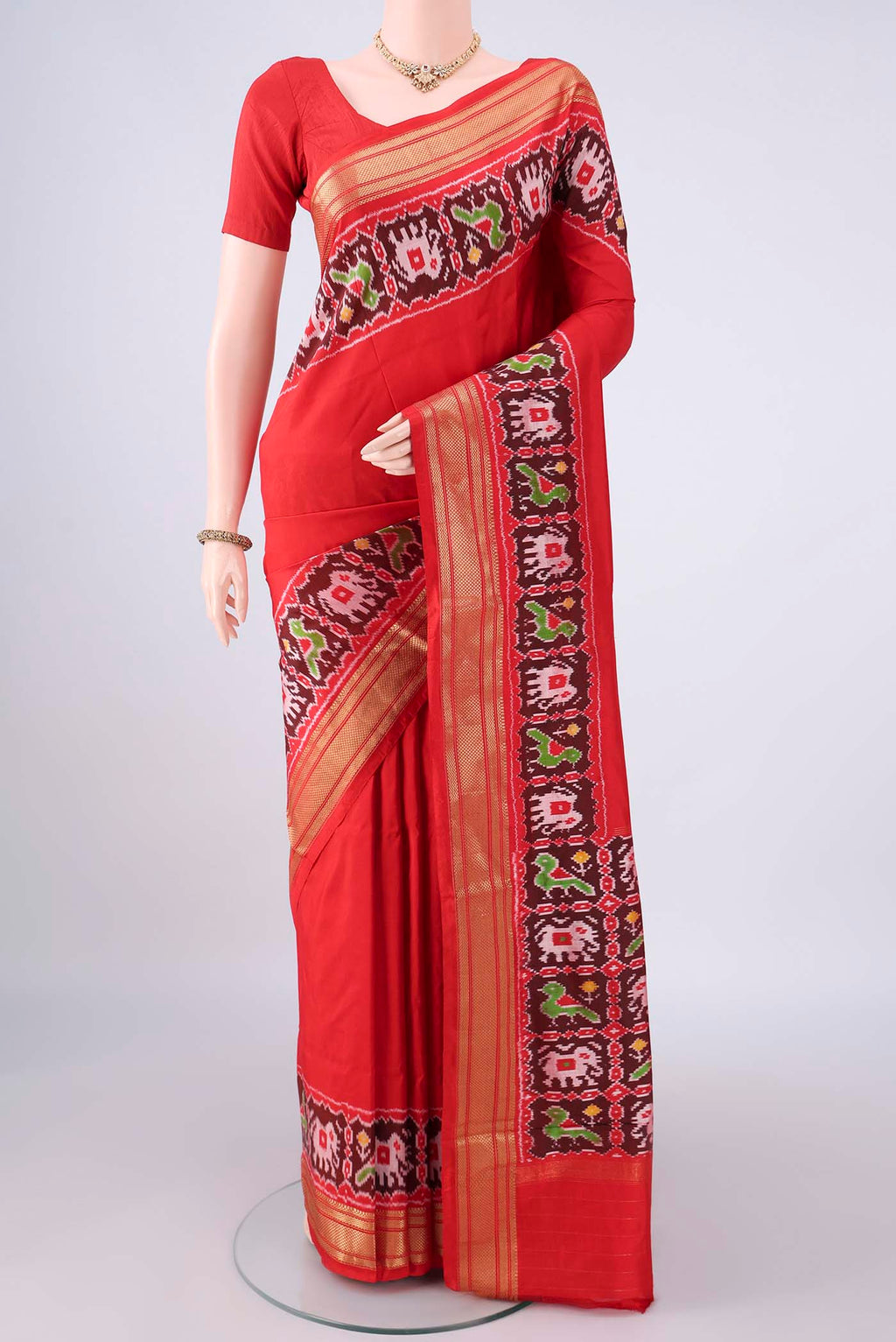 Pure Silk Red Dual Tone Pochampally Saree with Plain Body and Zari Border.  displayed on a mannequin