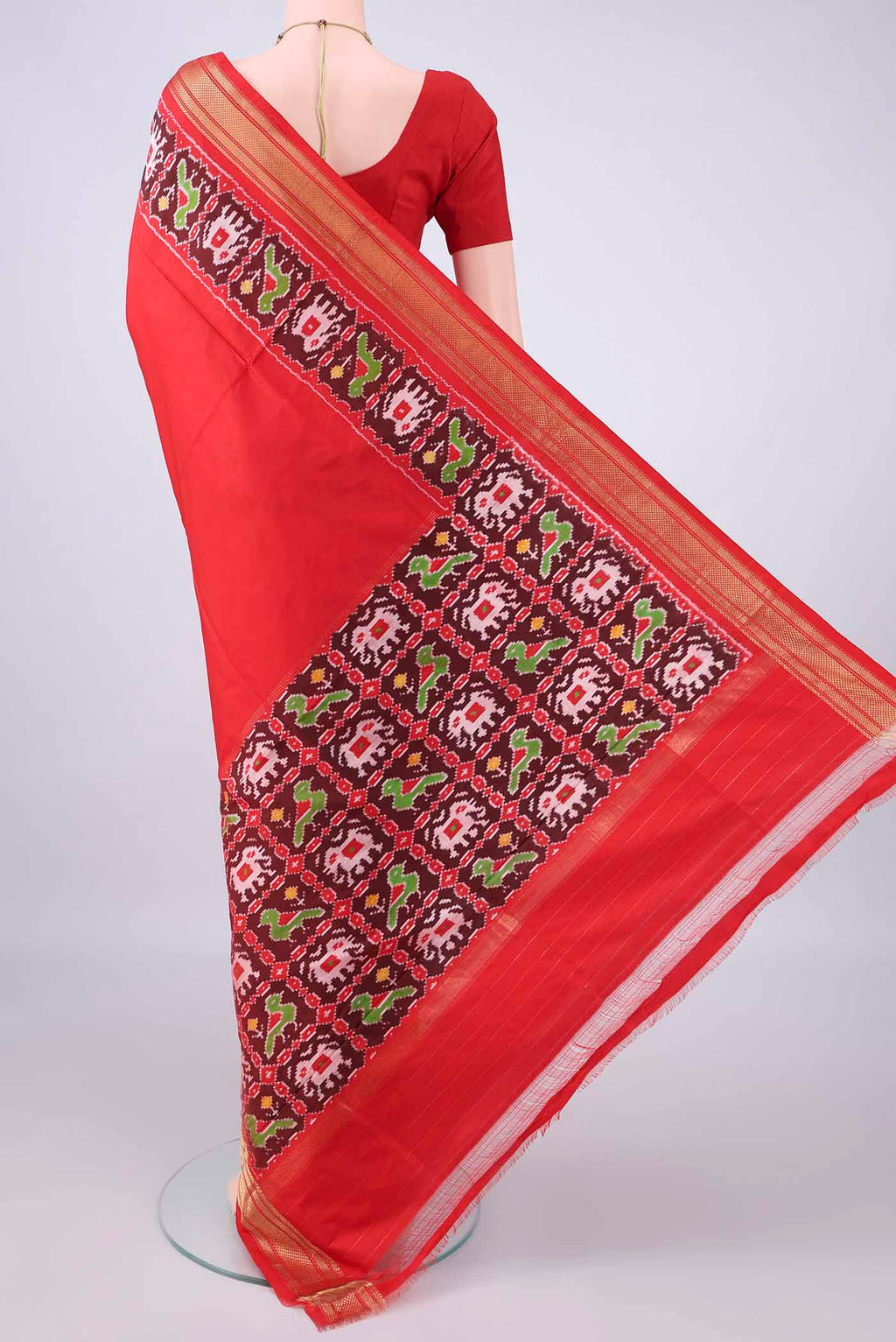 Flat view of Pure Silk Red Dual Tone Pochampally Saree with Plain Body and Zari Border. 