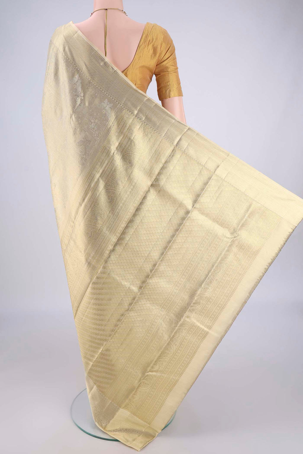 Flat view of Golden Kanjivaram Silk Saree with Zari Brocade on the body and Zari Border. 