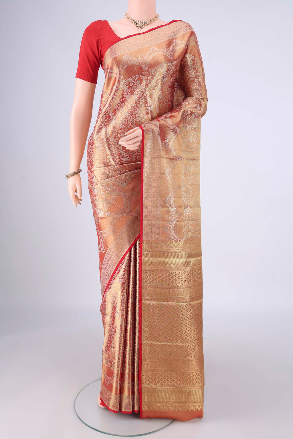 Gold with Red Color Kanjivaram Silk Saree with Zari Brocade on the body and Zari Border.  displayed on a mannequin