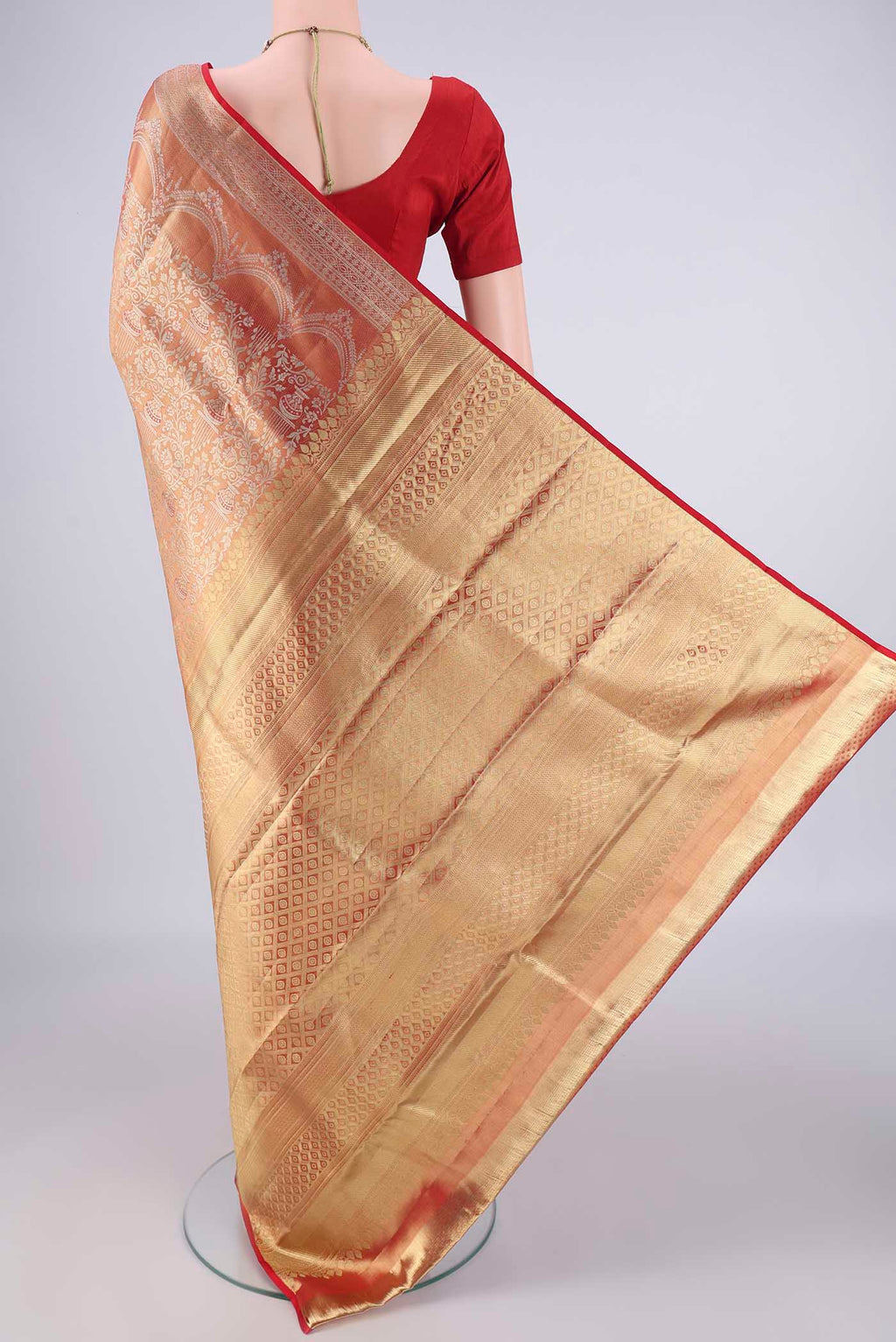 Flat view of Gold with Red Color Kanjivaram Silk Saree with Zari Brocade on the body and Zari Border. 