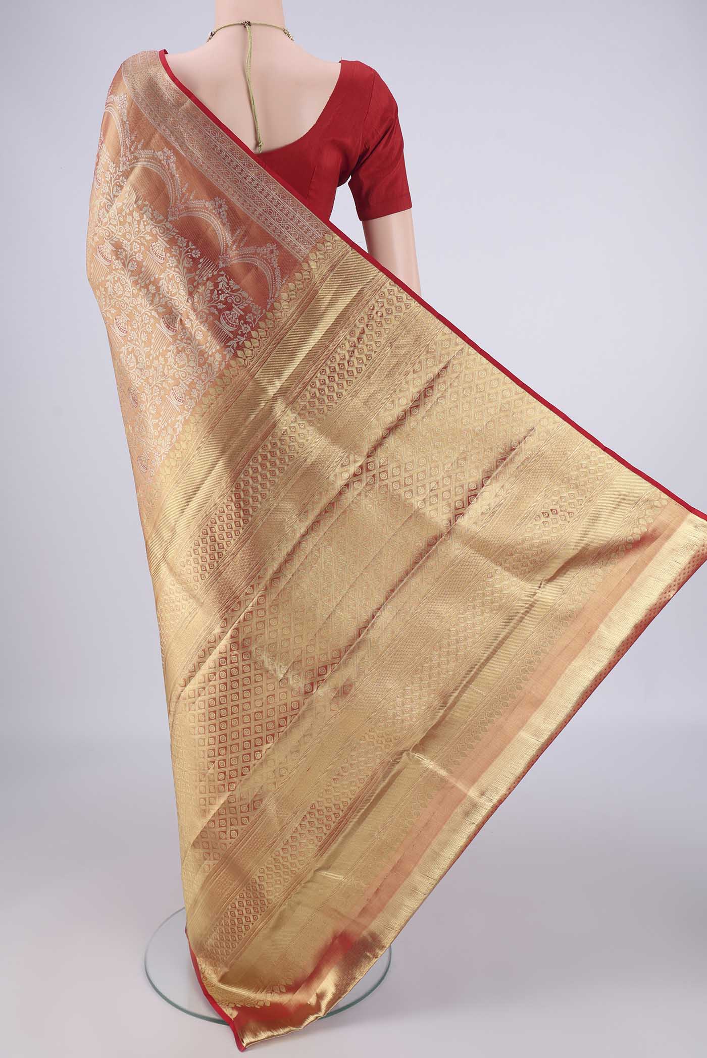 Flat view of Gold with Red Color Kanjivaram Silk Saree with Zari Brocade on the body and Zari Border. 