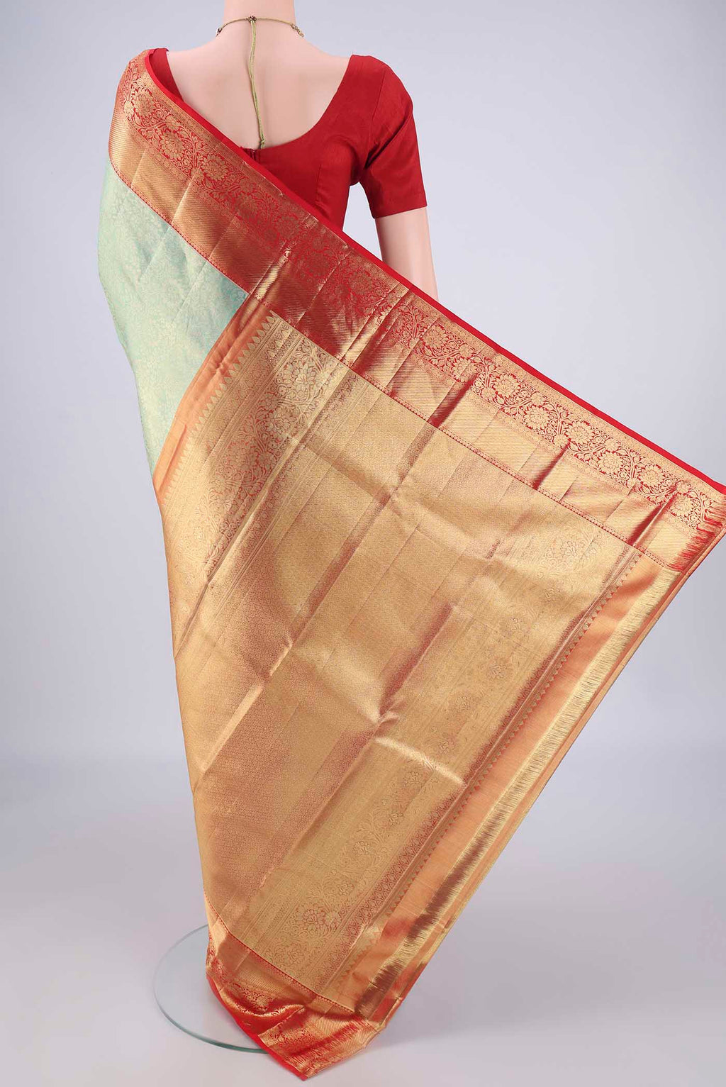 Flat view of Mint Green Dual Tone Kanchipuram Tissue Silk Saree with Zari Brocade on the body and Zari Border. 