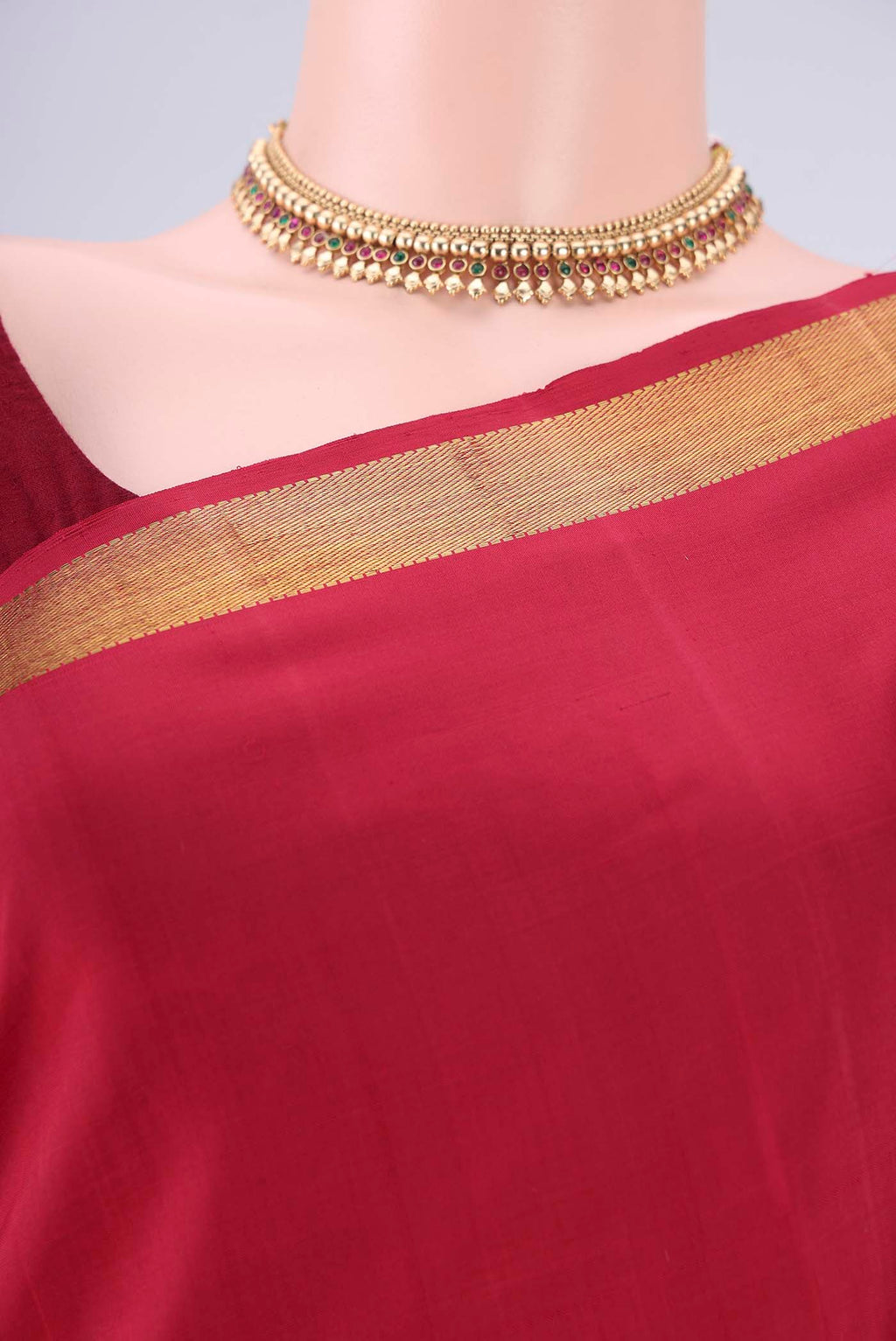 Border image of Red Kanjivaram Silk Saree with Plain Body and Zari Border. 