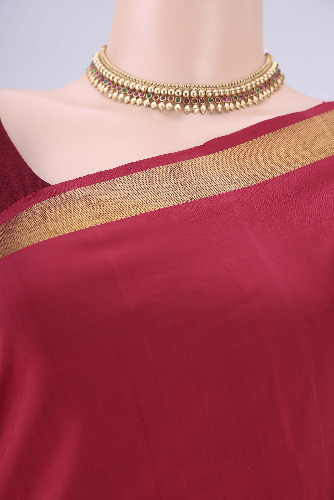 Border image of Red Kanjivaram Silk Saree with Plain Body and Zari Border. 
