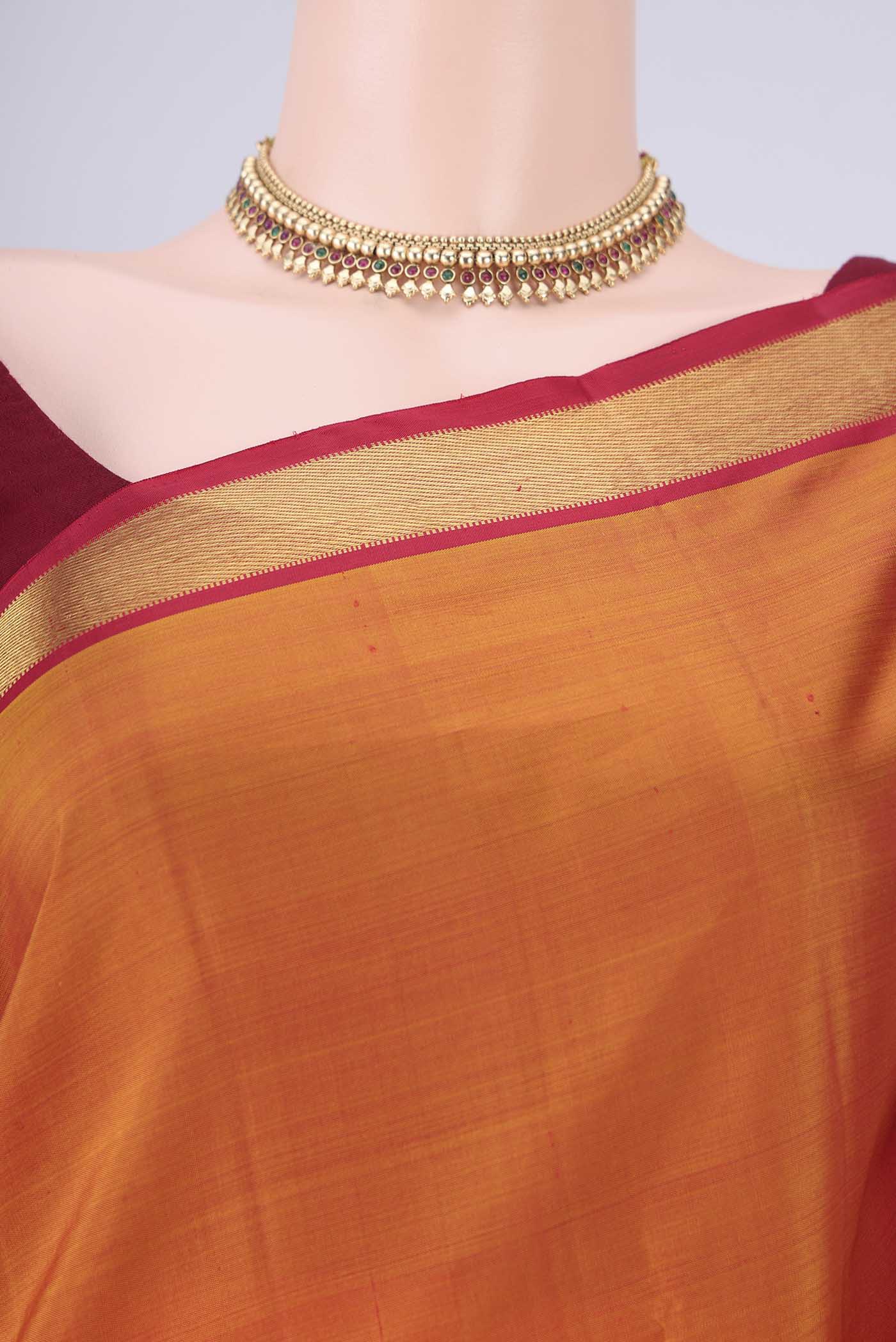 Border image of Mustard Kanjivaram Silk Saree with Plain Body and Zari Border. 