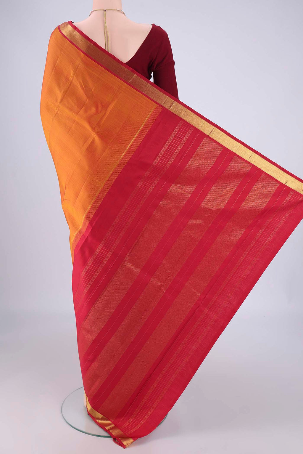 Flat view of Mustard Kanjivaram Silk Saree with Plain Body and Zari Border. 