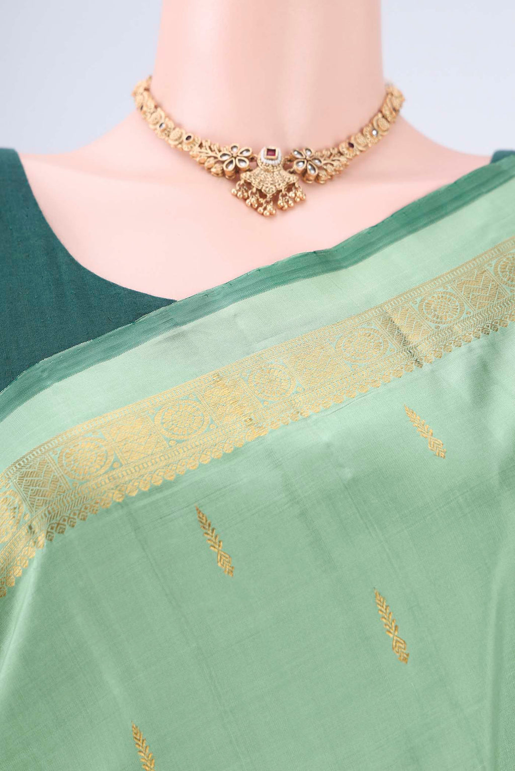 Border image of Light Green Kanchipuram Silk Saree with Zari Butta on the body and Zari Border. 
