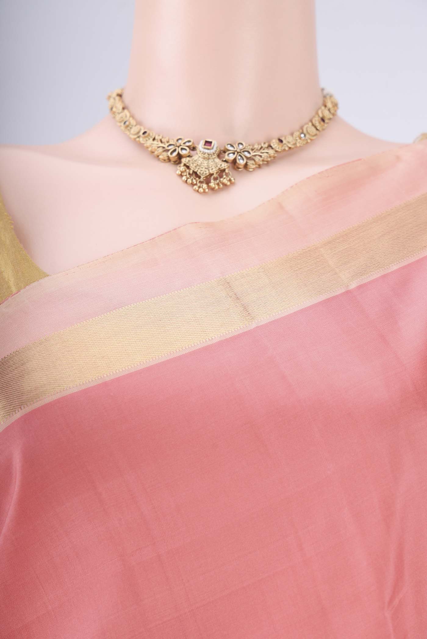 Border image of Peach Kanchipuram Silk Saree with Plain Body and Zari Border. 