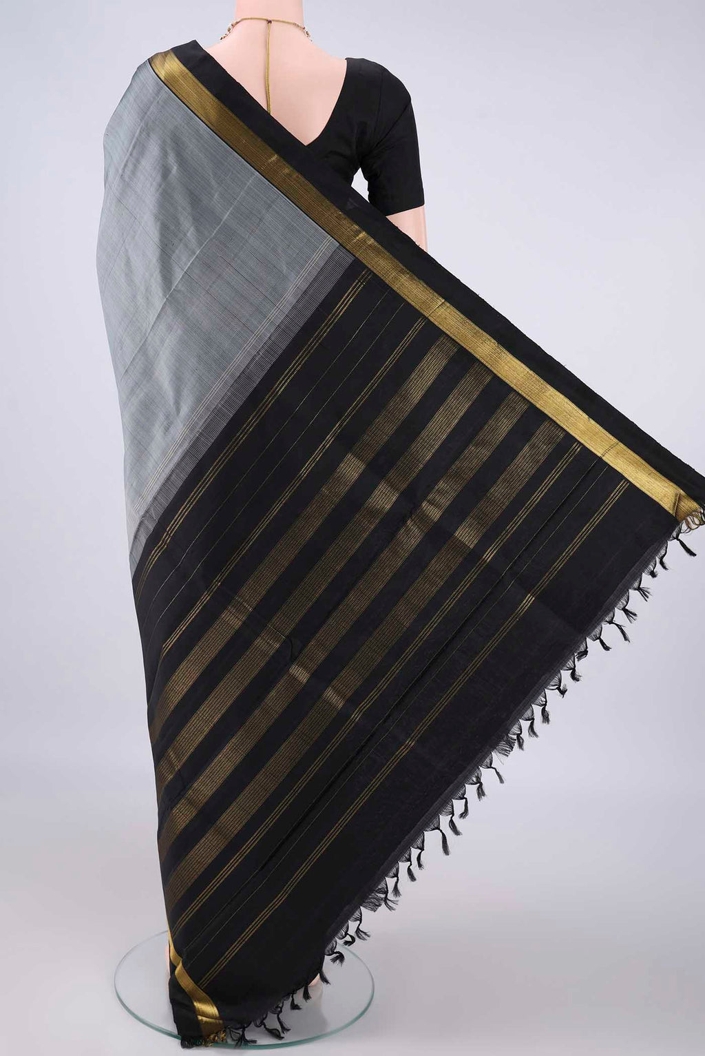 Flat view of Pure Silk Grey Kanchipuram Saree with Plain Body and Zari Border. 
