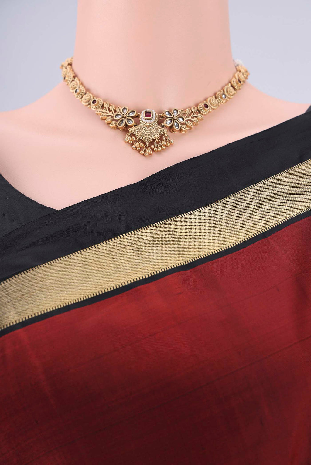 Border image of Rust Kanchipuram Silk Saree with Plain Body and Zari Border. 