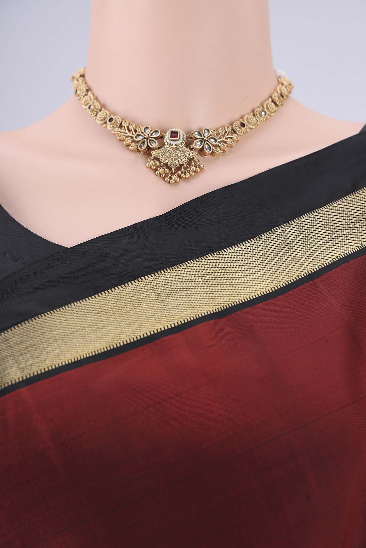Border image of Rust Kanchipuram Silk Saree with Plain Body and Zari Border. 