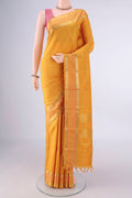 Pure Silk Mustard Kanchipuram Saree with Plain Body and Zari Border.  displayed on a mannequin