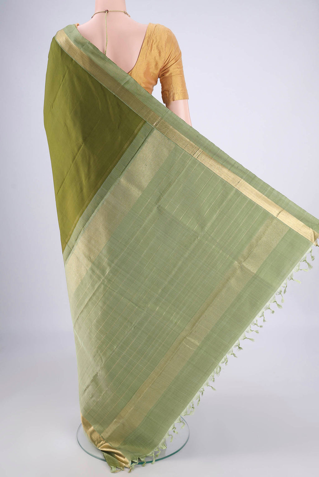 Flat view of Mehandi Green Kanchipuram Silk Saree with Plain Body and Zari Border. 