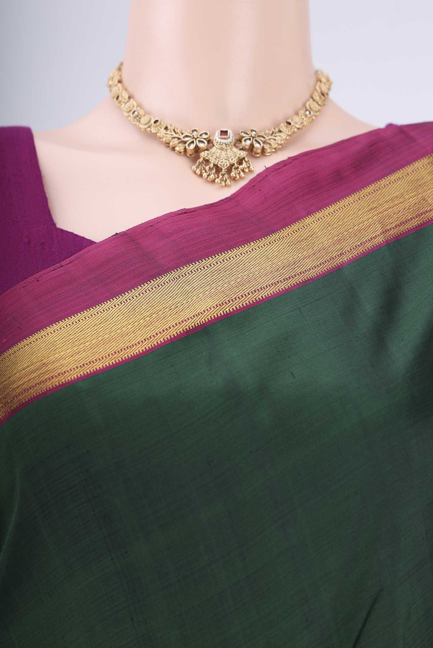 Border image of Bottle Green Kanchipuram Silk Saree with Plain Body and Zari Border. 