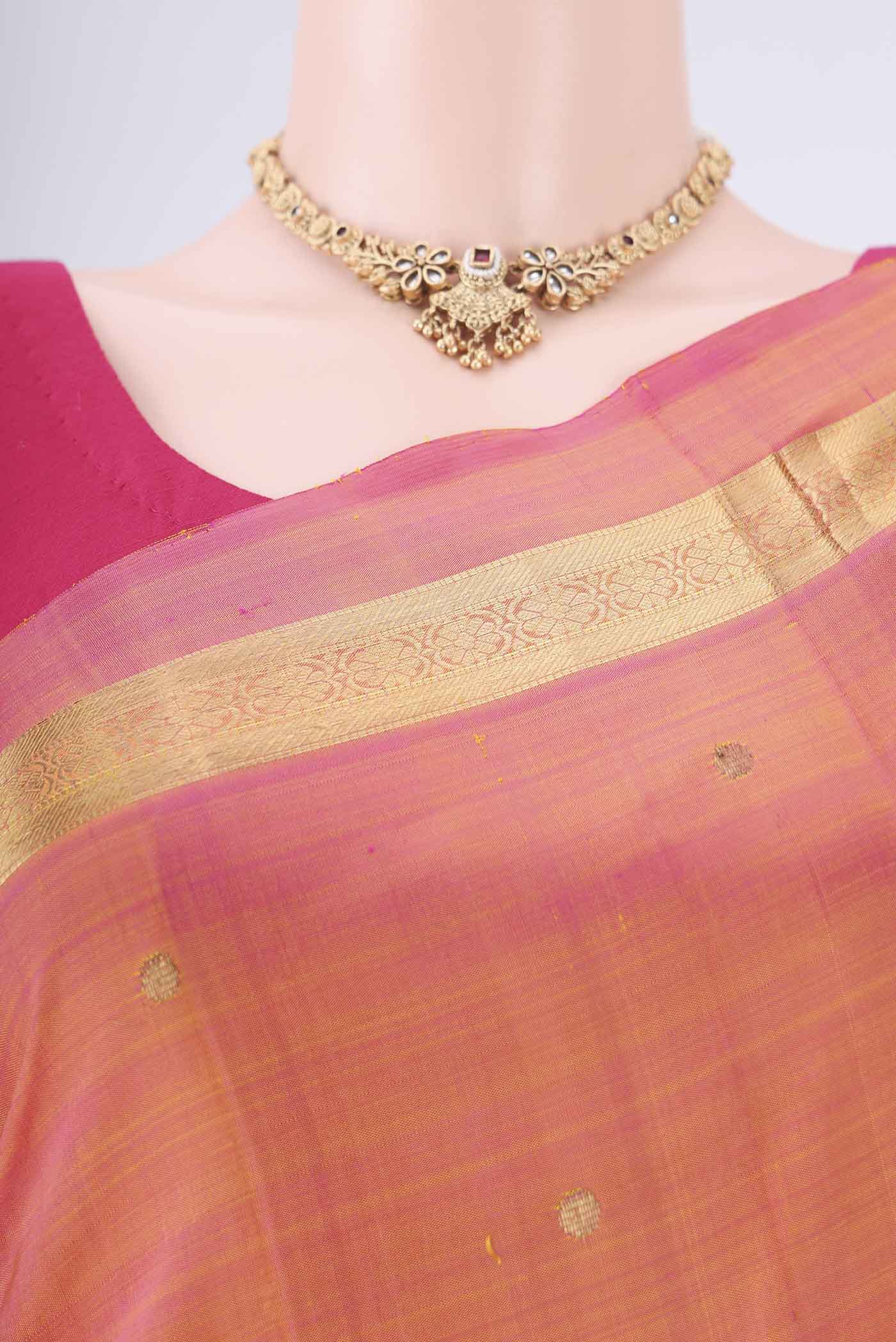Border image of Pinkish Yellow Kanjivaram Silk Saree with Zari Butta on the body and Zari Border. 